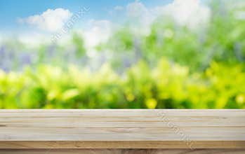 Wood table top on blur tree,garden in morning background.summer concept