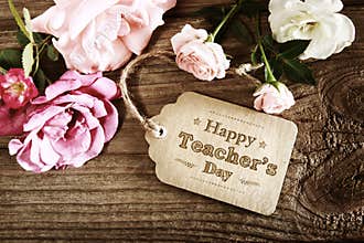 Happy Teachers Day message card with small roses