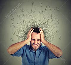 Stressed man upset frustrated has too many thoughts with brain melting into lines