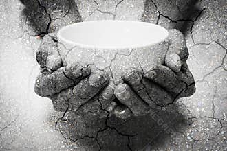 Double exposure hunger begging hands and dry soil