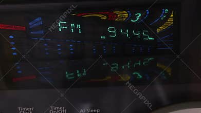 Digital radio receiver tune dial panel. Search for stations. Raising the sound