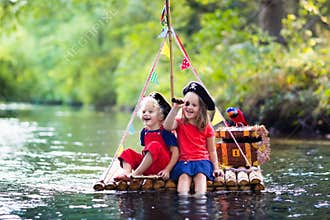 Kids playing pirate adventure on wooden raft