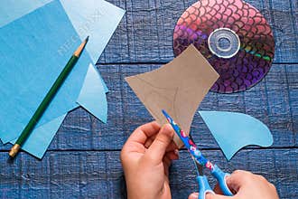 Making toy fish from the CD. Handmade children's project. Step 3