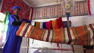 Sample of handmade carpet fabrics in a traditional Berber house, Ouarzazate, Morocco