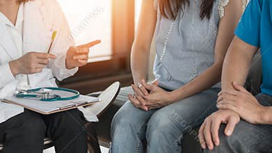 Patient couple having doctor or psychologist consulting on marriage counseling, family medical healthcare therapy