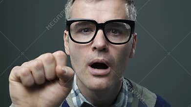 Clueless nerd guy knocking on the screen