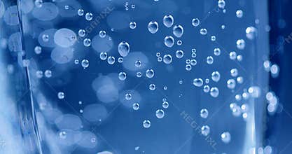 A glass filled with fresh mineral water.