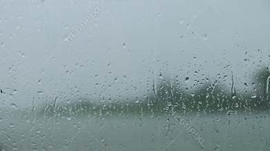 Environment and Ecology Concept. Rain Drop on Glass Window. Rainy Day