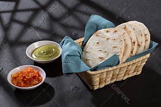 Arepas typical food from Latin America - basket with white corn arepas