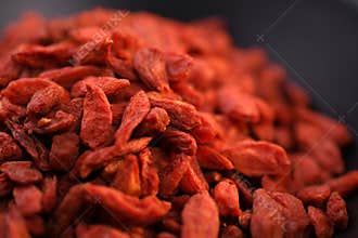 Close-up of Goji berries in black bowl