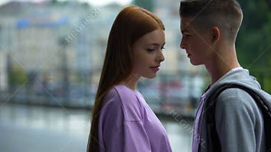 Dating couple of teenagers looking each other, tender relations, first love