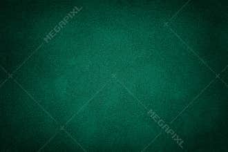 Dark green matt suede fabric closeup. Velvet texture