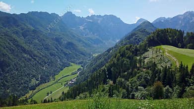 Mountain landscape, Alps in Slovenia with farm and blooming meadows