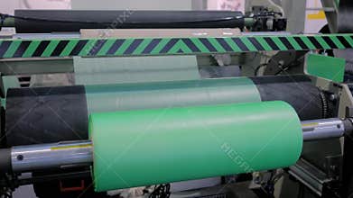 Automatic plastic bag making machine - roller with green polyethylene film