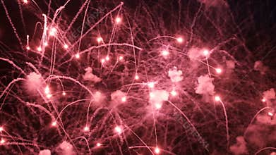 Beautiful festive multi-colored fireworks in the dark sky. Celebrating the anniversary of a city day, independence