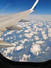 Airplane above clouds