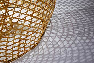 Weaved bamboo vine texture with shadows on the ground