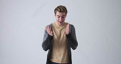 Excited man showing gratitude towards his achievement