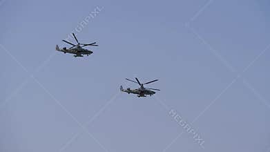 Flying a couple of helicopters over the mountains. Aerobatics. Kamov helicopters with two rotors. Helicopters with
