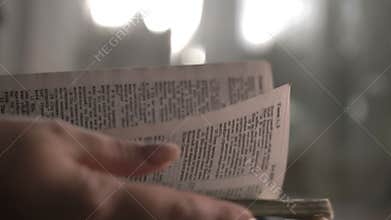 Woman reads a book turns over the pages, bible, copy space