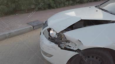 Unite Arab Emirates/Dubai - Circa 2020: Close up of a broken white car after an accident. Close op of broken car light after accid