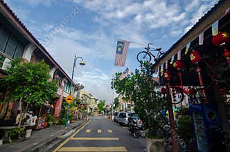 Armenian Street with old heritage house. A bicycle with Malaysia flag.