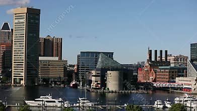 An aerial view of Baltimore`s Inner Harbor. Cityscape, National Aquarium in Background, Boats, Ferry and Luxury Yachts in