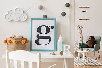 Cute interior of kid room with poster frame, baby accessories and toys.