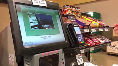 Motion of man tapping credit card for paying food at Safeway store