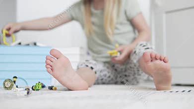 A little girl plays in the designer of the house