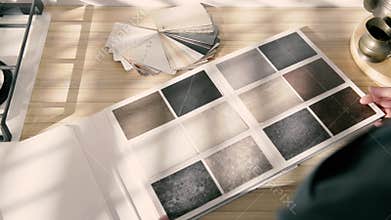 Catalog of textures for kitchen countertops in the hands of architect designer sales consultant