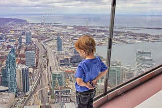 View of Toronto Downtown little boy looks down on the city