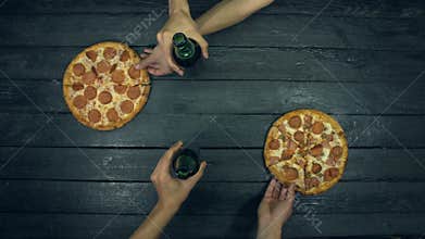Beer, pepperoni and meat pizza on ecological black background.