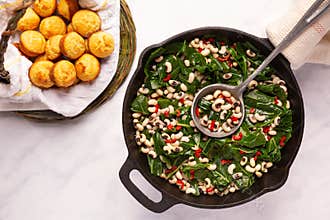 Close up of black-eye peas and collard greens
