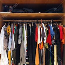 Clothes in full wardrobe