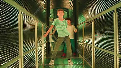 Teenage boy dancing floss in a luminous trumpet.