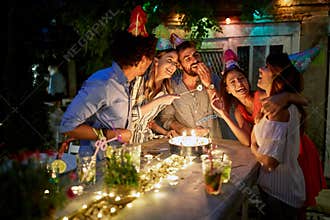 Friends enjoying with birthday girl on party