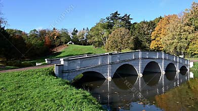 Bridge at Painshill gardens Cobham during the autumn sunshine
