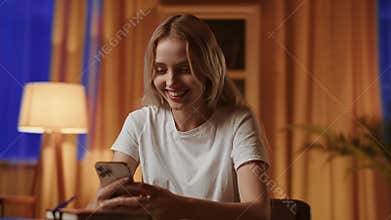 A young blonde girl with a sad mood uses the smartphone and unexpectedly receives notification about winning a large sum