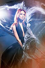 Fashion shoot of a young woman in a mystique dress