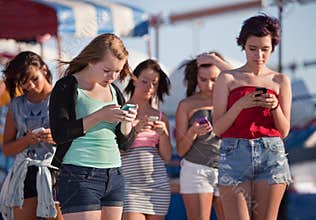Young Ladies Using Their Phones