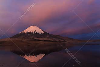 Parinacota volcano ladscape in Chile at sunset