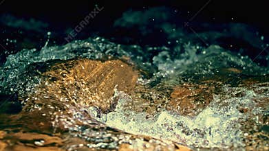 Slow motion ripple waves on dark water river.Amazing dramatic night cinematic backgrounds.Super slow motion detail 4k