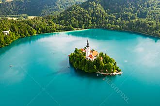 Aerial view of lake Bled with assumption of Mary Pilgrimage Church on the small island on the background of Julian Alps in