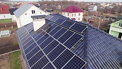 Residential house with solar panel system on roof.