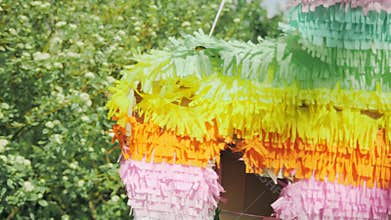 Close-up of the side of the pinata after it was beaten with sticks