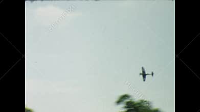 Supermarine spitfire aircraft performing aerobatics in a 1970s airshow, united kingdom