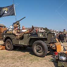 Living History: WWII reenactors enjoy a moment of downtime in their vintage