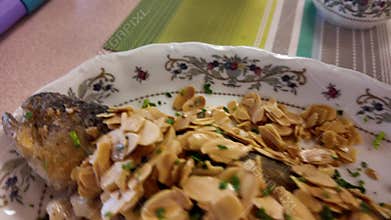 Grilled Trout with Almonds and Lemon on Plate