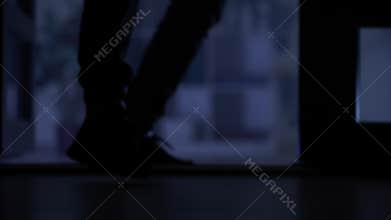 theft, man sneaks into apartment at night, legs close-up